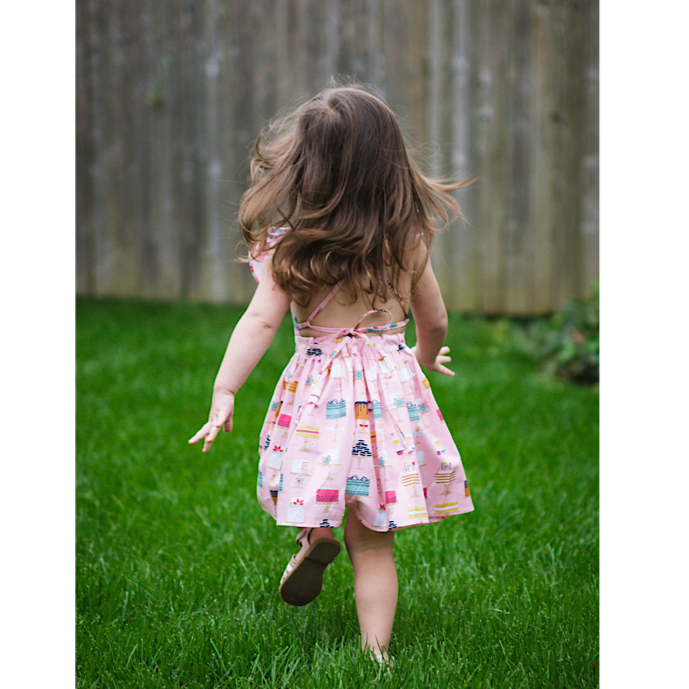 girl running in cakes dress