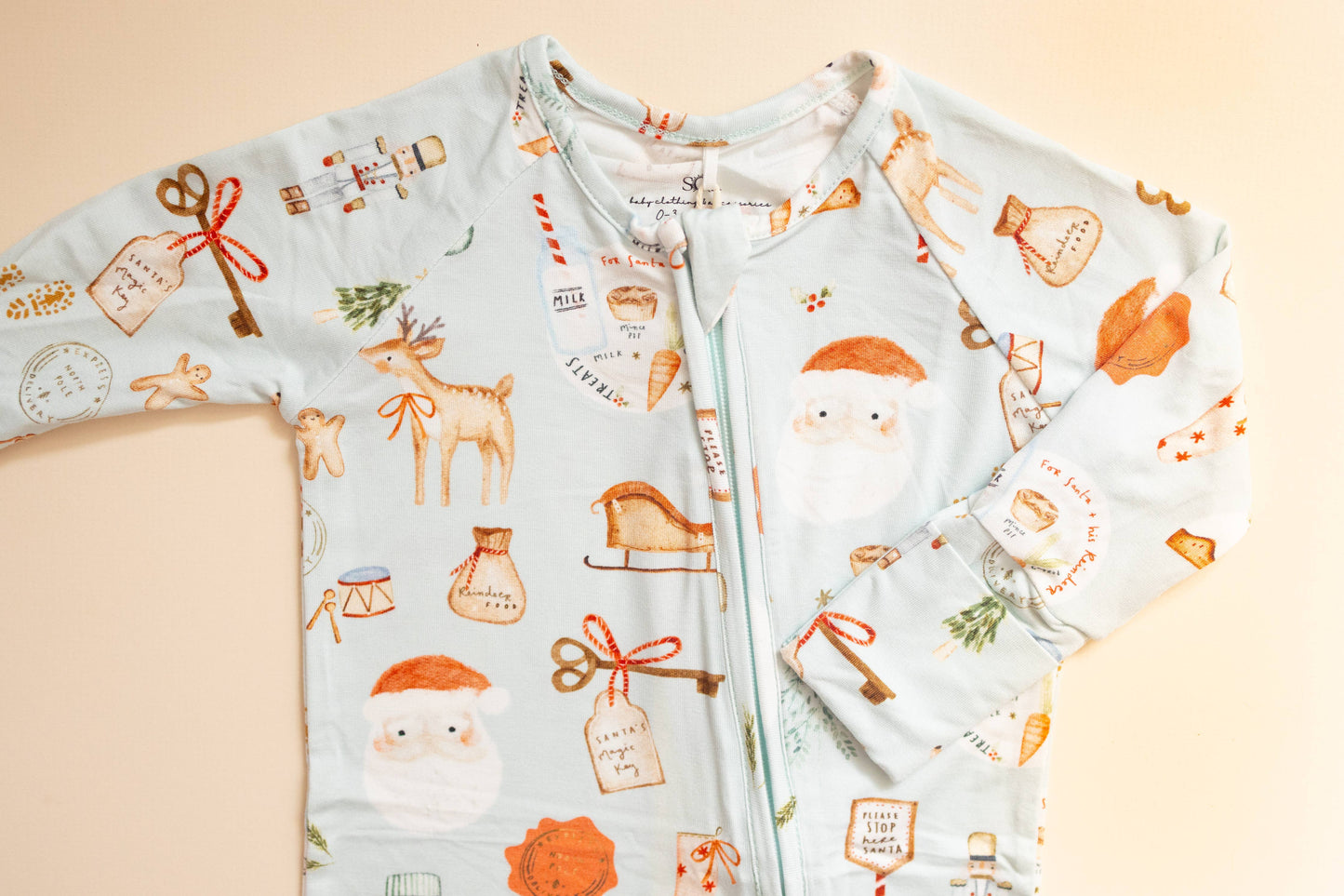 Children's hoodie with festive pattern on a beige background