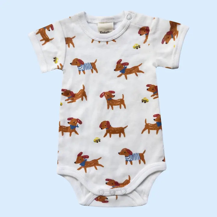 Baby onesie with dachshund pattern on a light blue background
