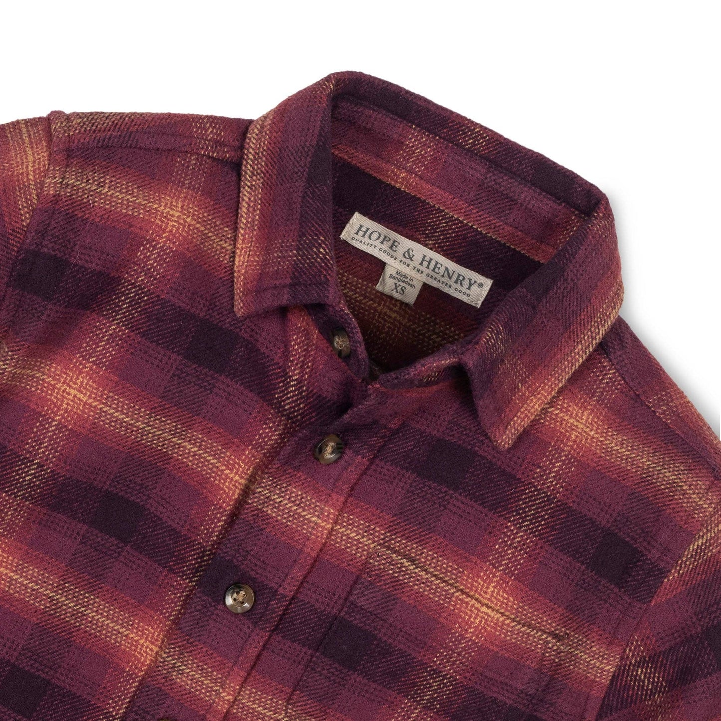 Plaid shirt with a visible brand label on a white background