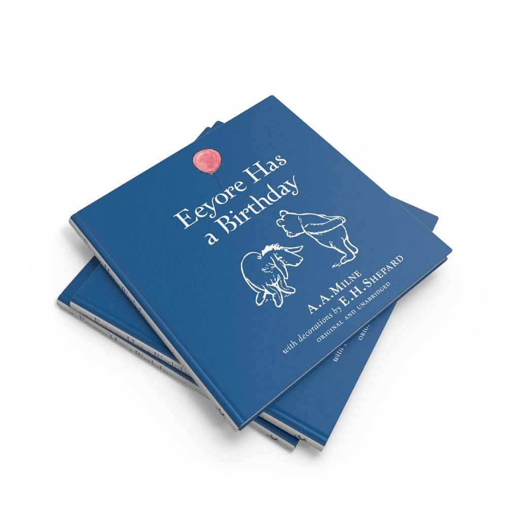 Stack of blue books with Eeyore design on a white background