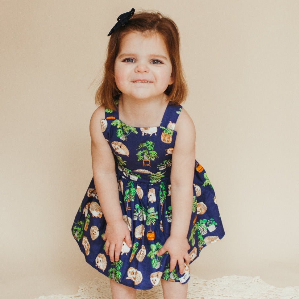 Pinafore dress in hedgehog and plants