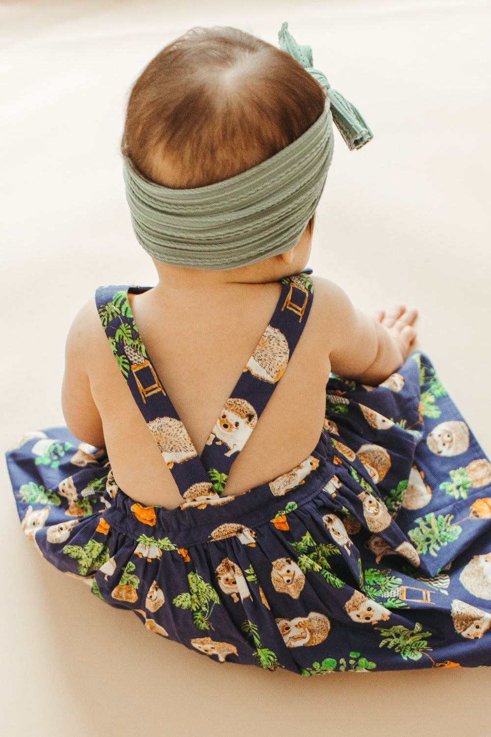baby back in pinafore dress