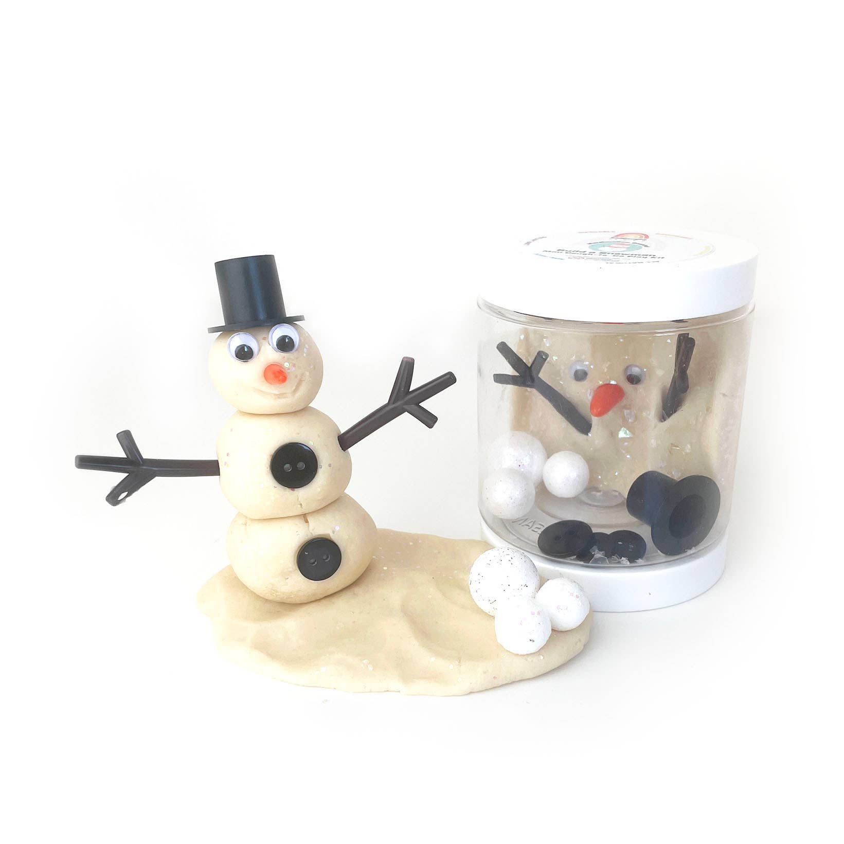 Snowman figurine and a jar of snowman-themed playdough on a white background