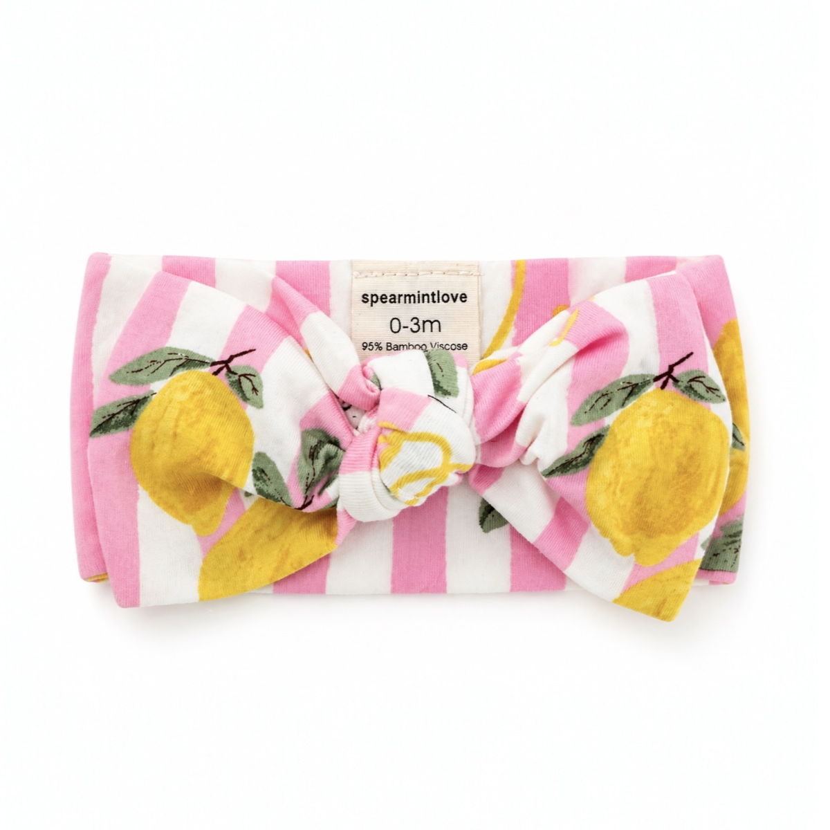 Baby bow with lemon and striped pattern on a white background