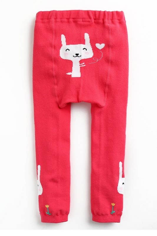 Red children's leggings with white cartoon design on a white background