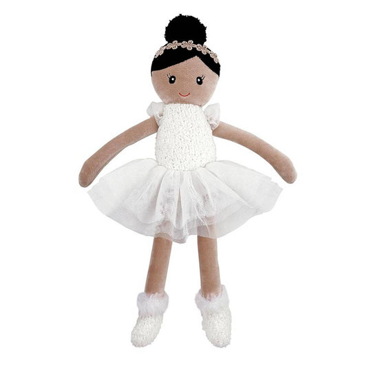 Doll in a white dress with a black bun on a white background