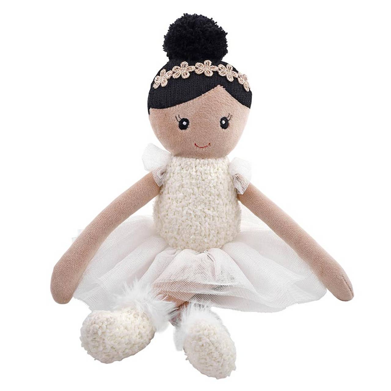 Toy doll with black hair, white dress, and pom-pom details on a white background