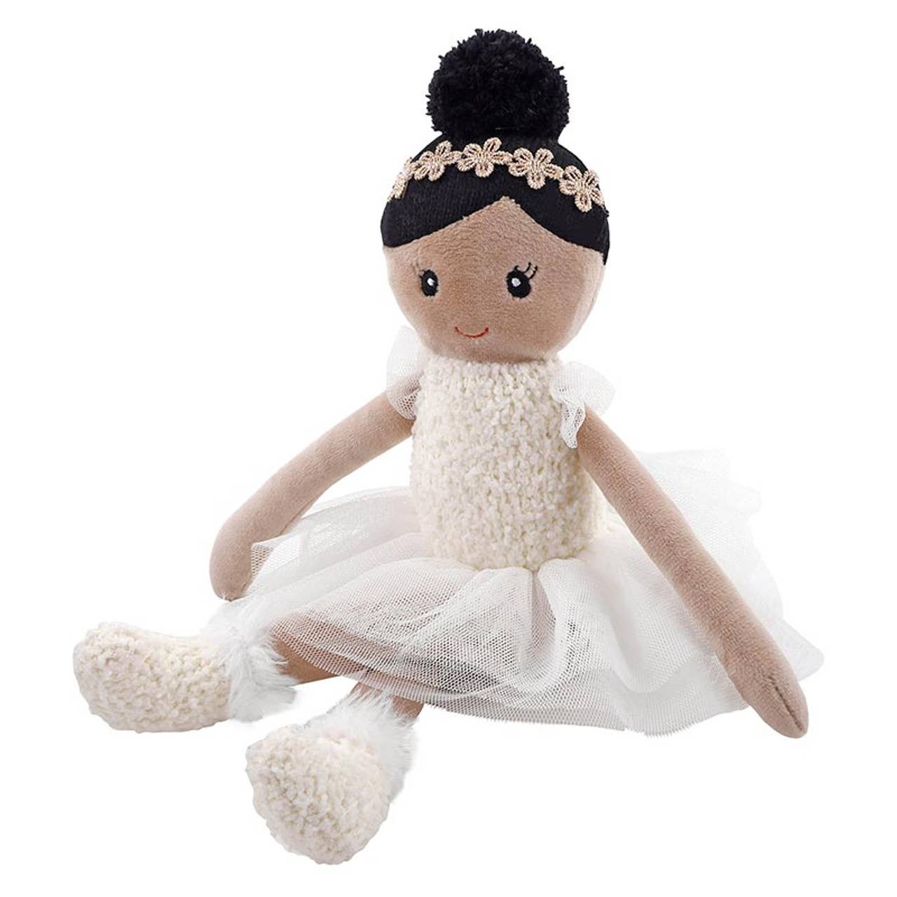 Stuffed doll with a white dress and black hair on a white background