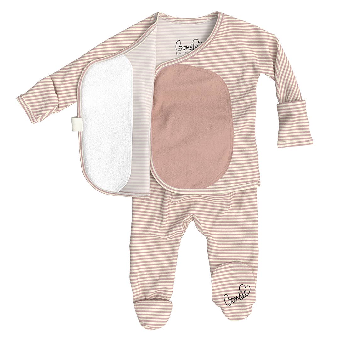 Baby onesie with long sleeves and feet, featuring a pink patch on a white background.