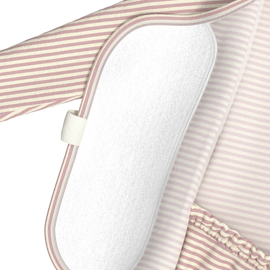 Close-up of a white pillow with pink and white striped fabric draped over it.