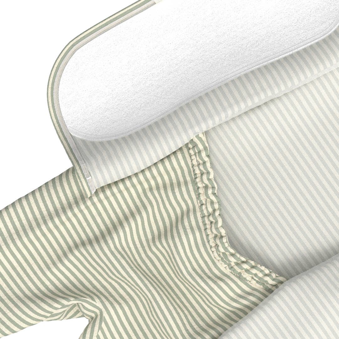 Close-up of a green and white striped fabric with a white border