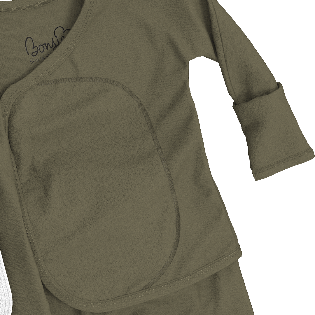 Close-up of a baby long-sleeve romper in olive green, showing the front bib-style panel and a small black script logo on the chest.