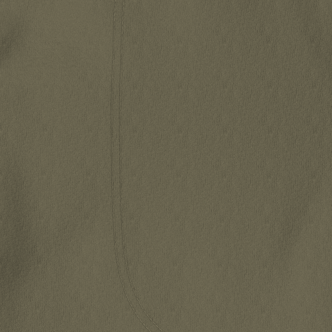 A close-up of a solid olive green textured fabric with a subtle vertical seam.