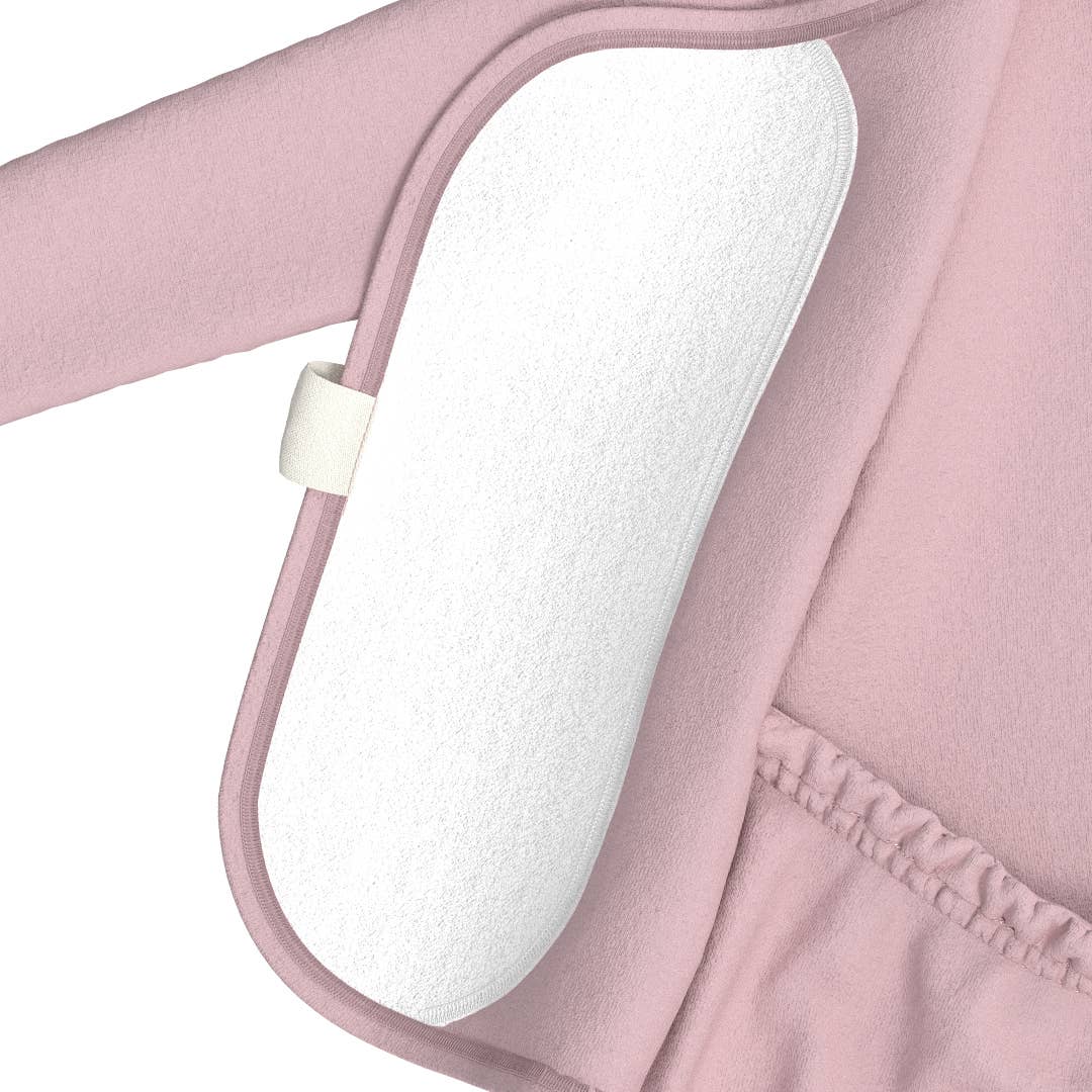Close-up of a pink baby carrier with a white cushioned area.