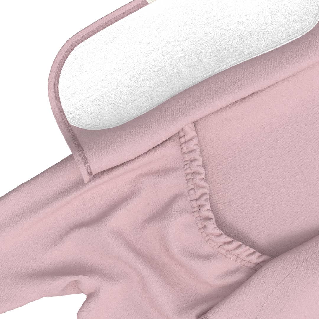 Close-up of a pink garment with a white tag on a white background