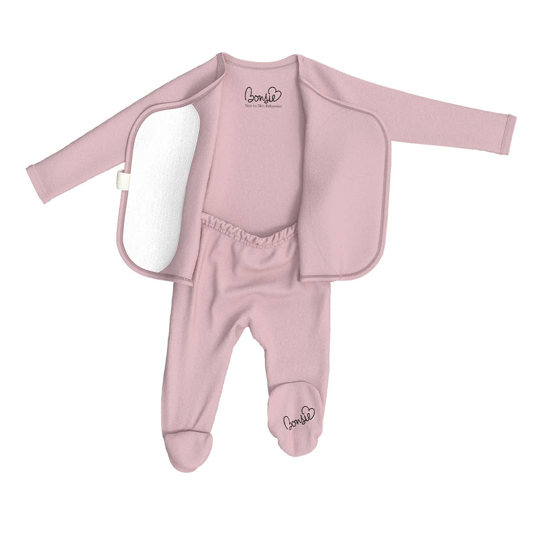 Pink baby outfit with jacket on a white background