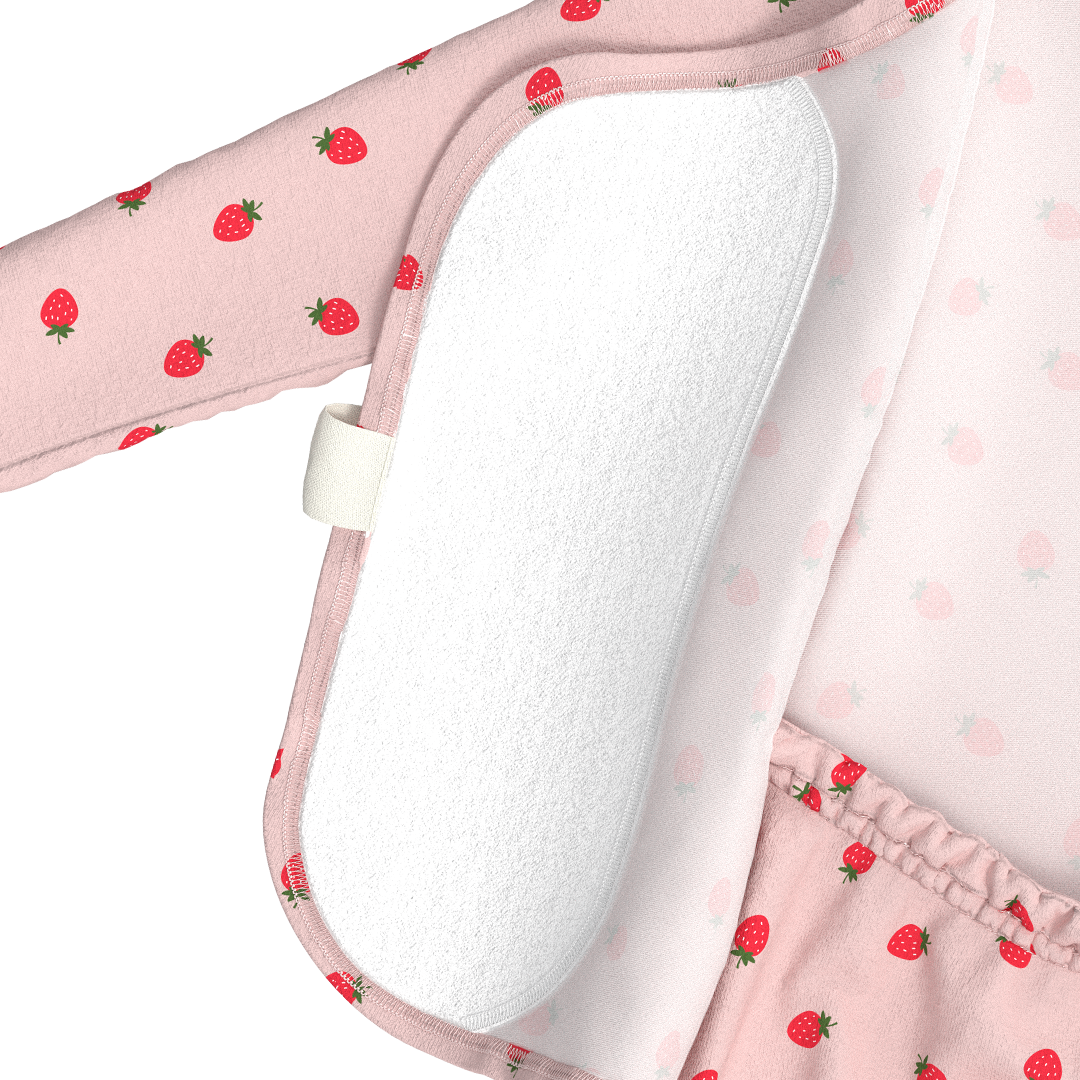 Pink baby bouncer with strawberry pattern and white cushion