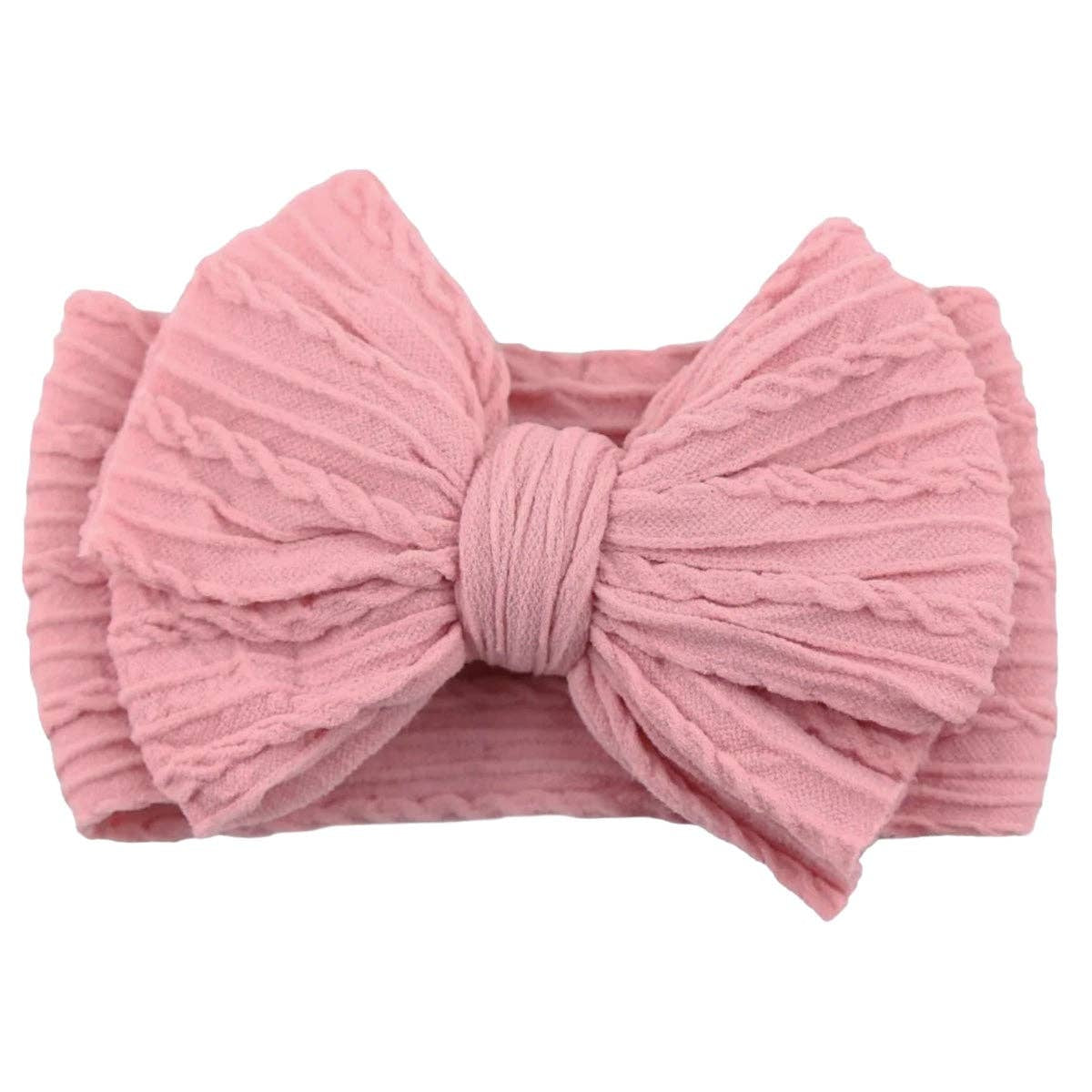 Pink bow headband on a white background