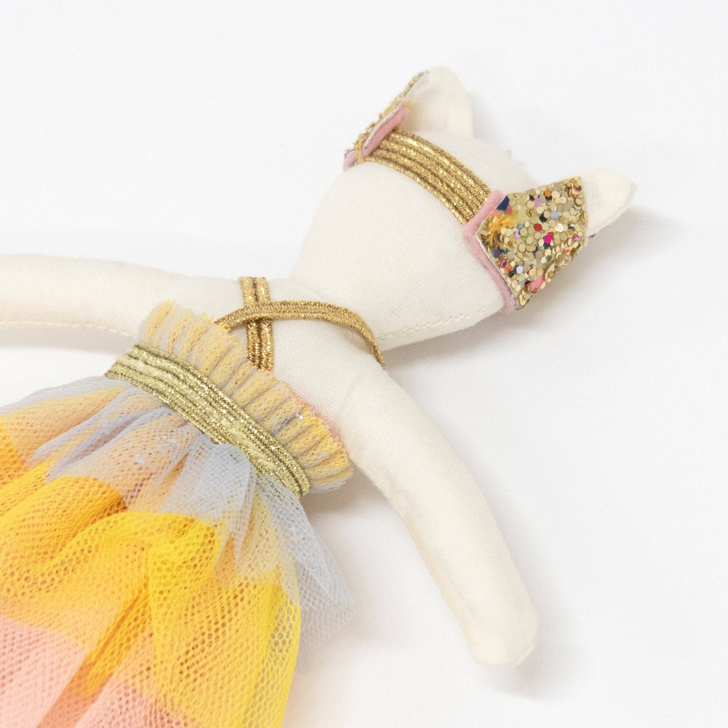 Decorative napkin ring with gold band and colorful tulle on a white background