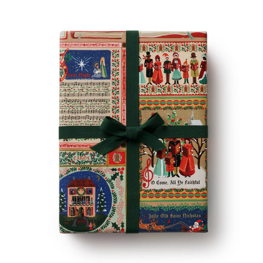 Gift box with festive design and green ribbon on a white background