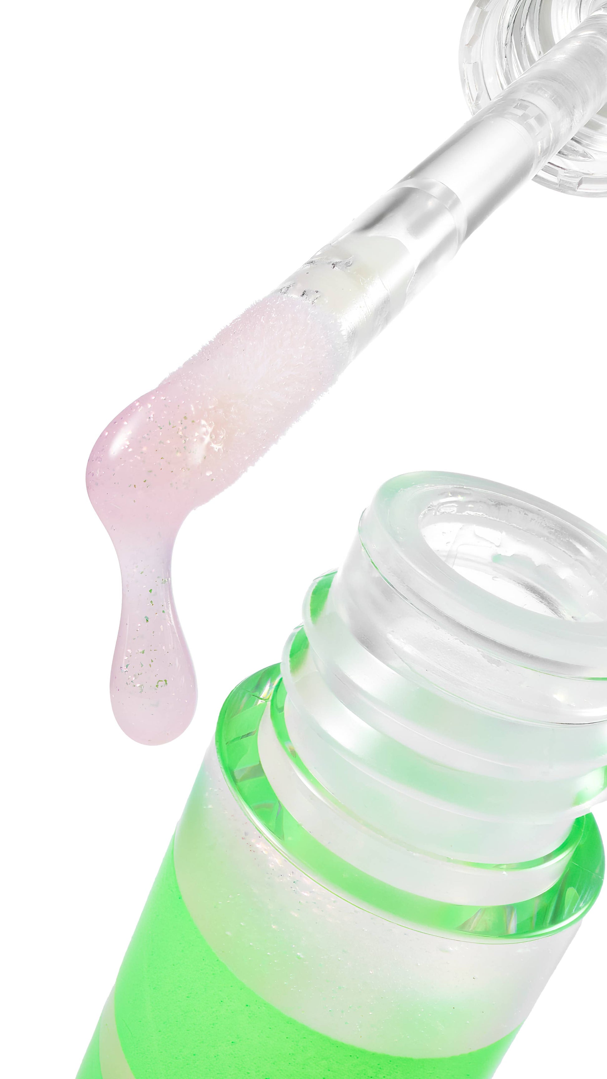 Close-up of a green bottle with a pink dropper on a white background