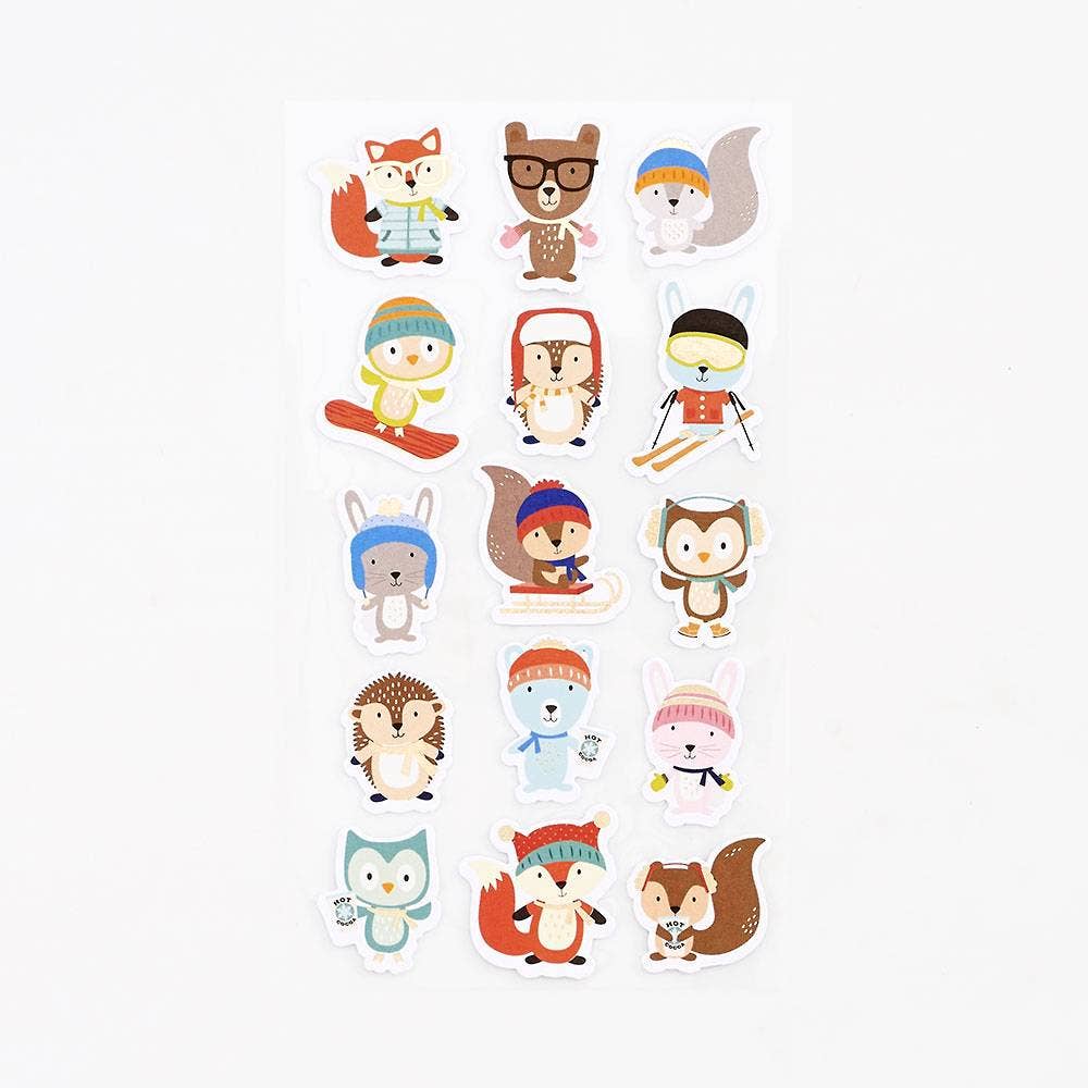 Set of cartoon animal characters wearing winter clothing on a white background
