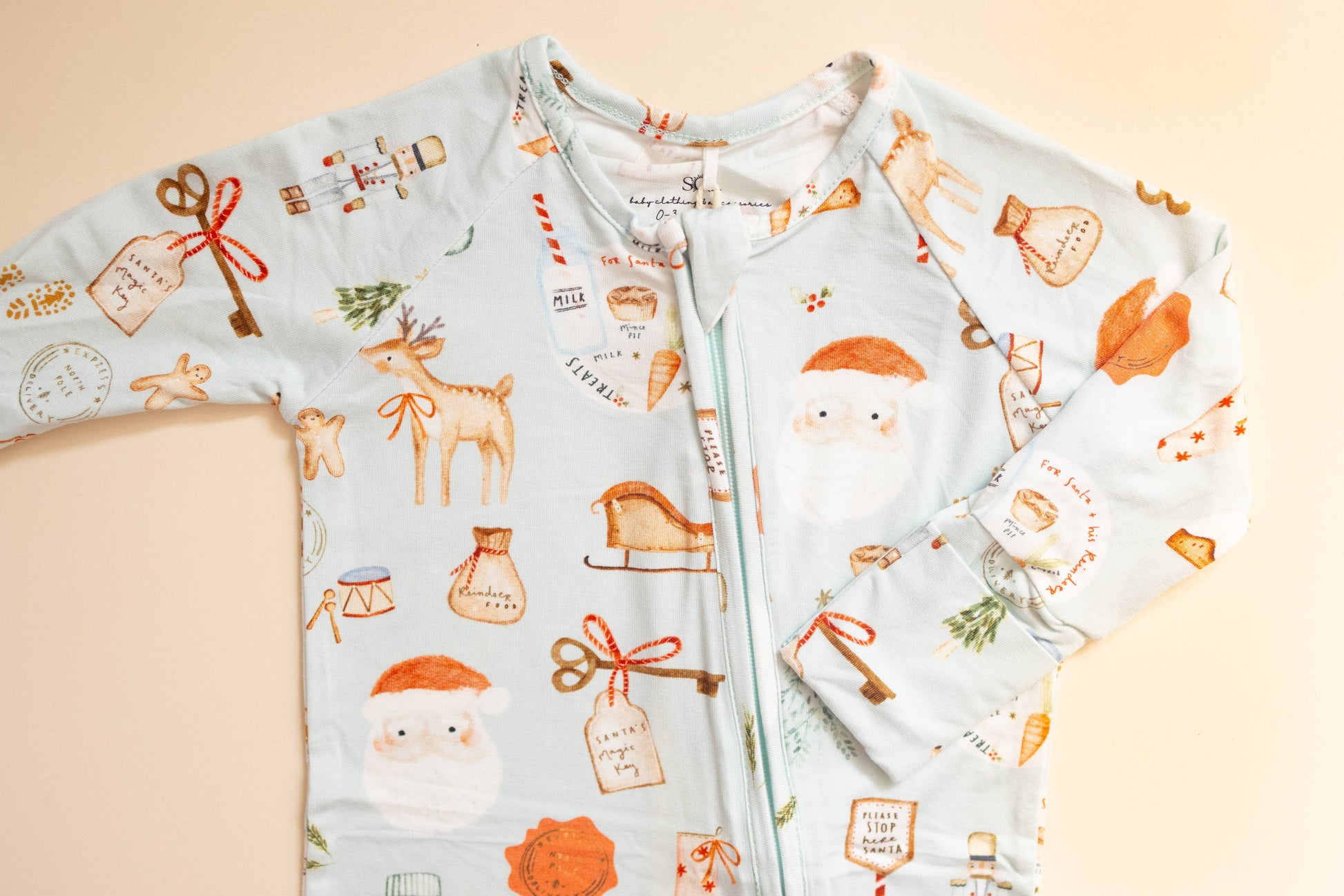 Children's hoodie with festive pattern on a beige background