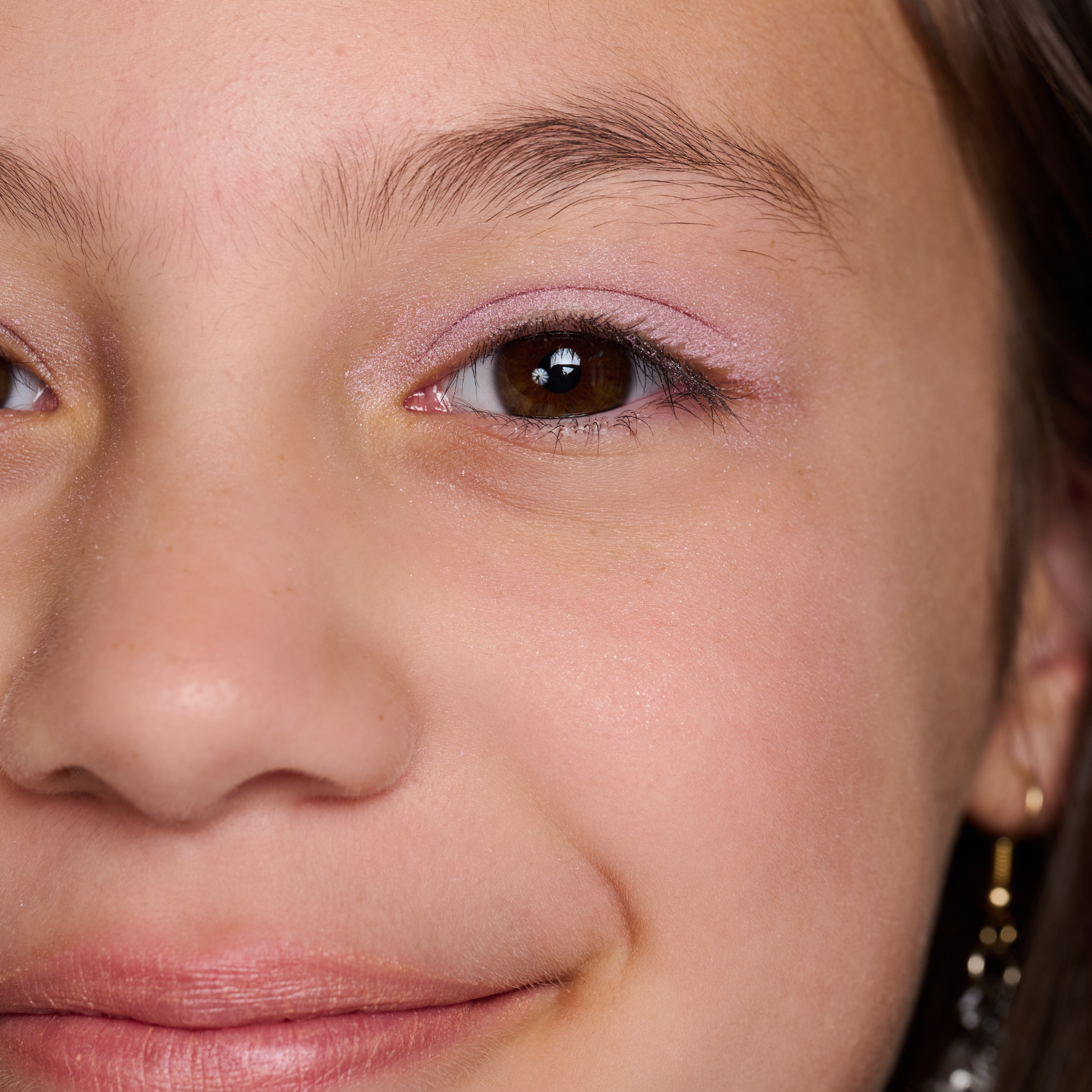 Close-up of a person's face with a focus on the eye area.