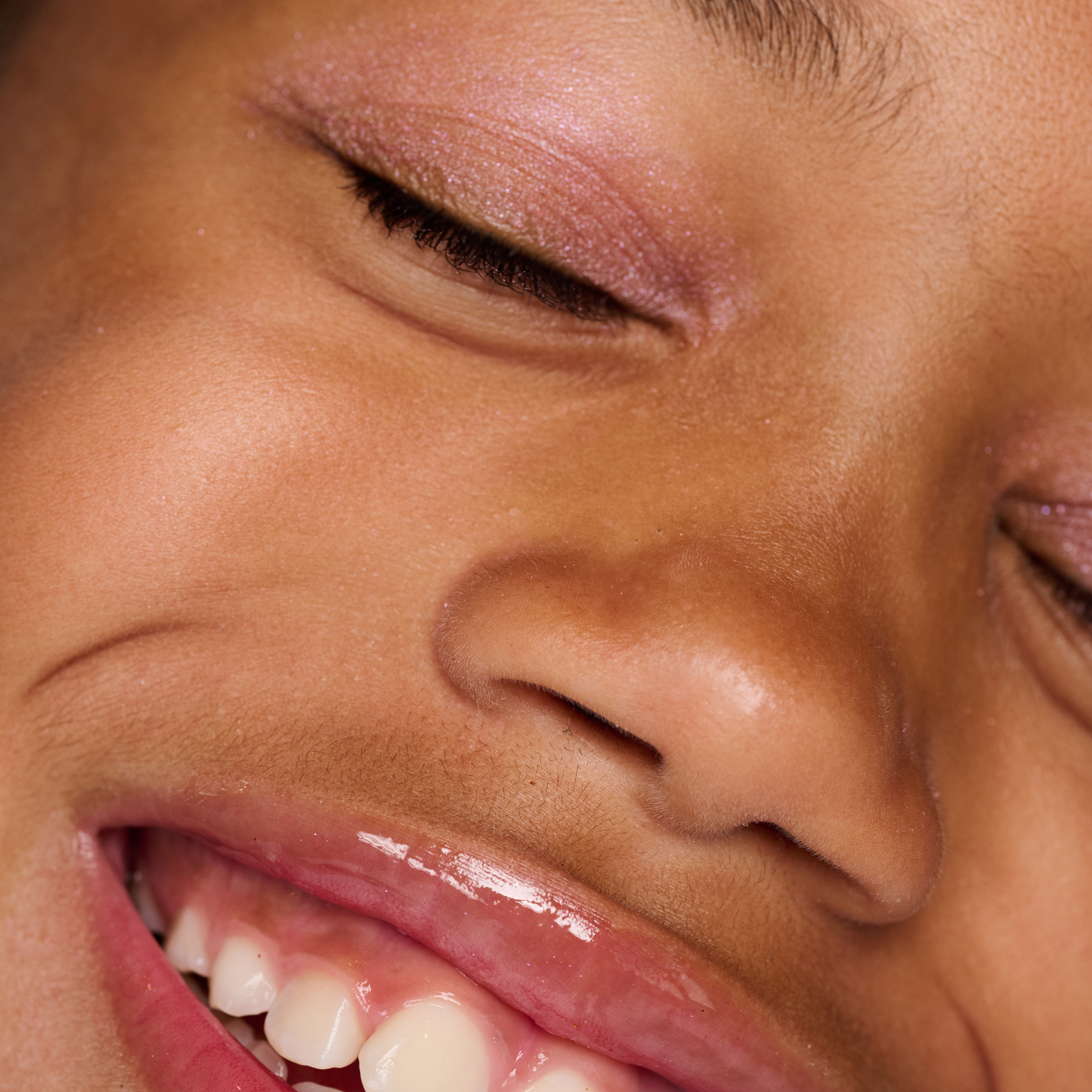 Close-up of a person's face with a focus on the eye and nose area.