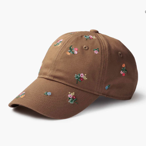 Brown cap with floral embroidery on a white background