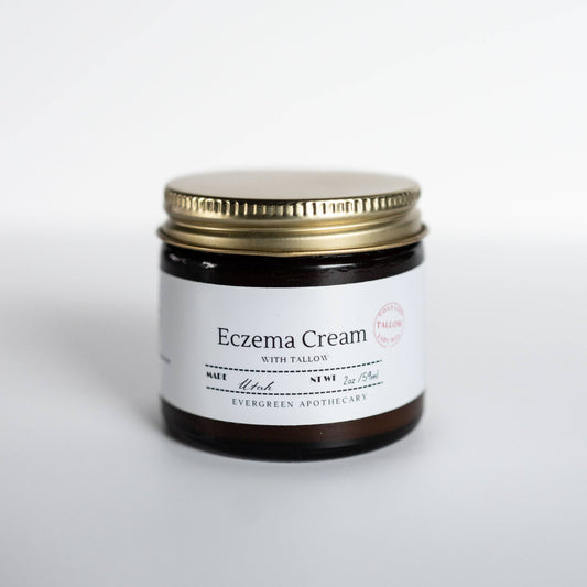 Eczema cream jar with gold lid on a white background