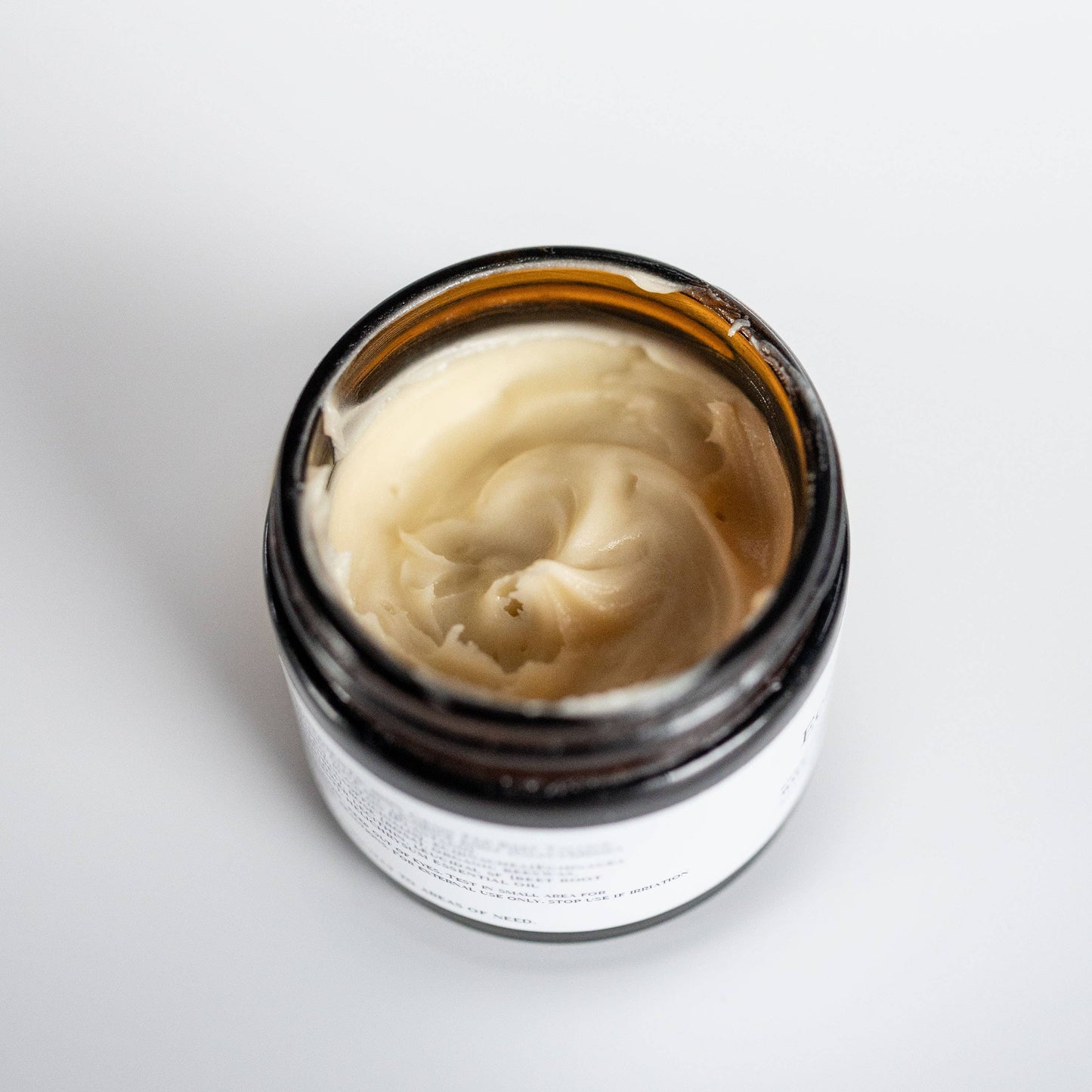 Jar of cream on a white background