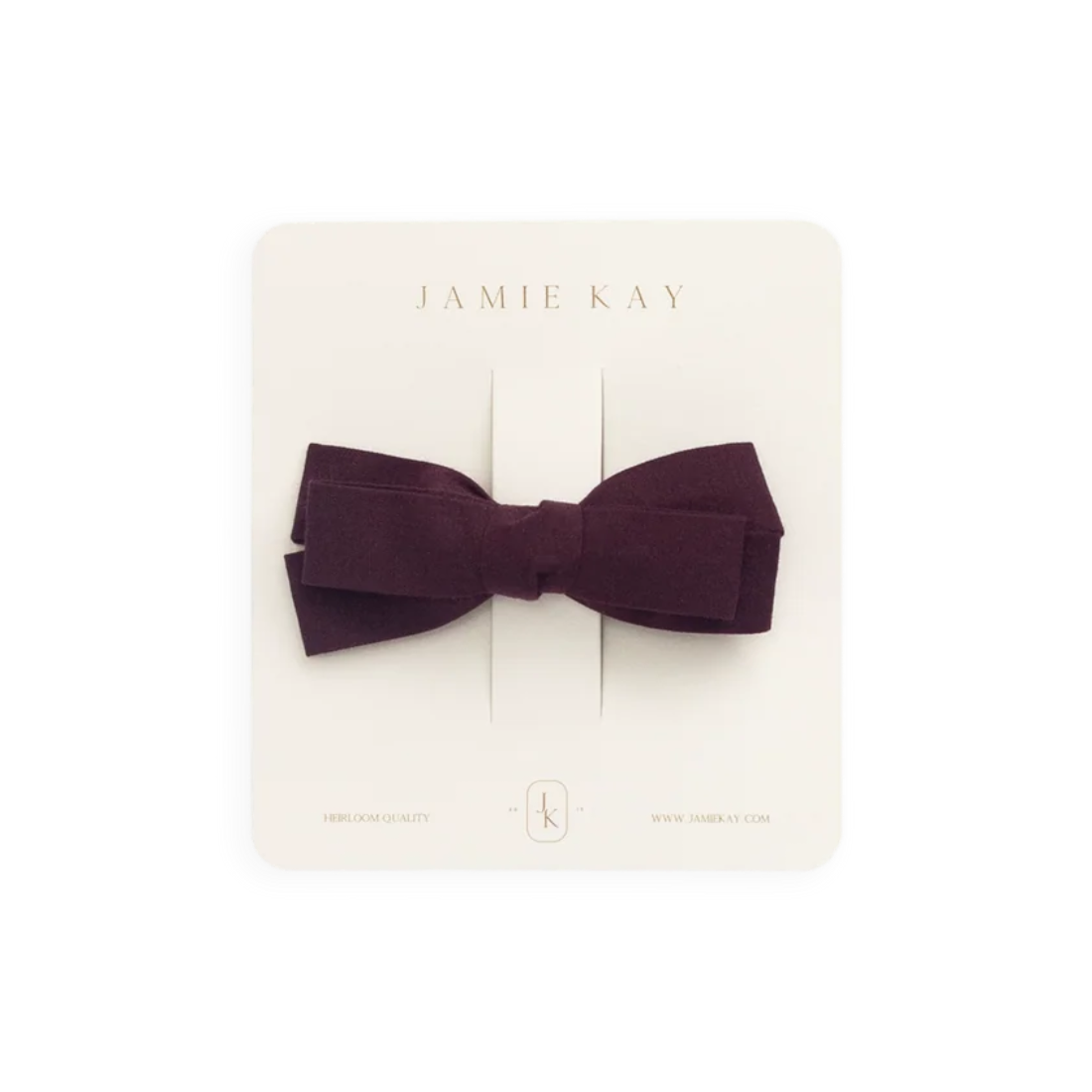 A dark plum bow tie displayed on a cream-colored Jamie Kay brand card against a solid white background.