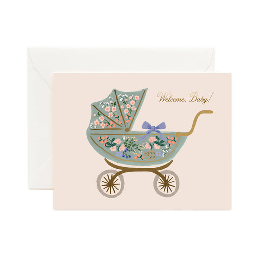 Greeting card with a floral baby carriage design and 'Welcome Baby!' text on a beige background.