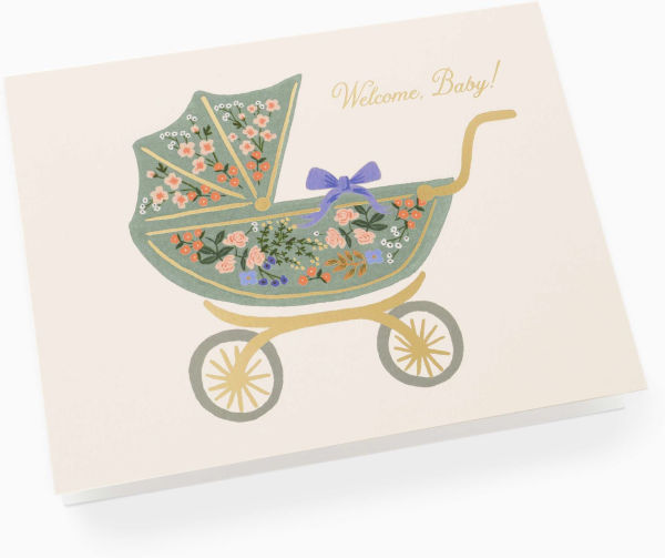 Greeting card with a floral baby carriage design and 'Welcome Baby!' text on a beige background.