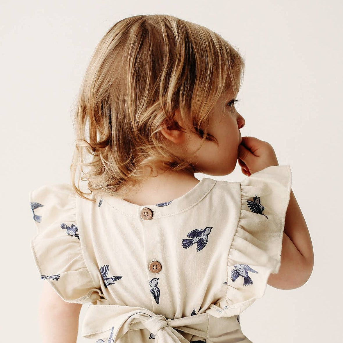 back of ruffle bluebird romper