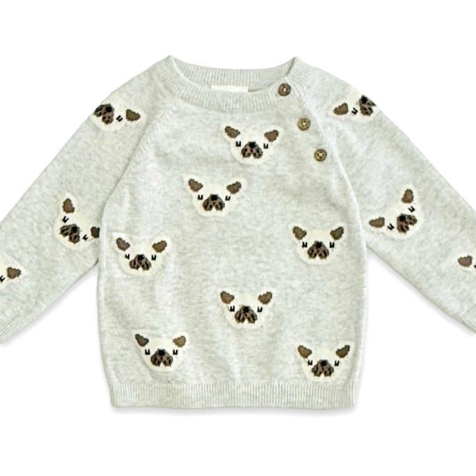Light gray sweater with dog face patterns on a white background
