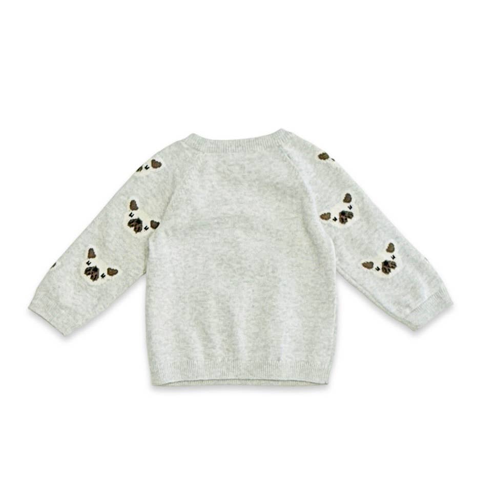 Gray sweater with butterfly patterns on sleeves against a white background