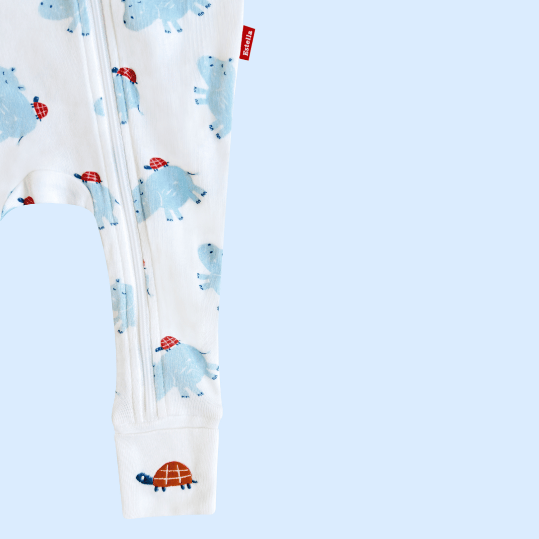 Leggings with blue dinosaur pattern on a light blue background
