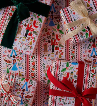 Gifts wrapped in colorful patterned paper with ribbons.