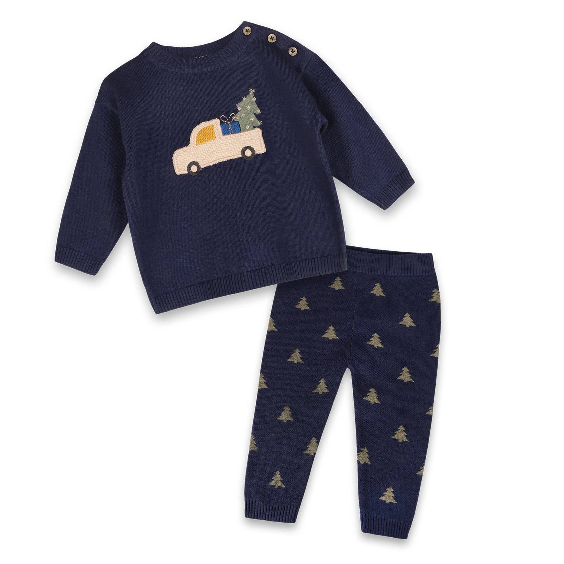 Navy sweater and pants set with Christmas tree and truck design on a white background