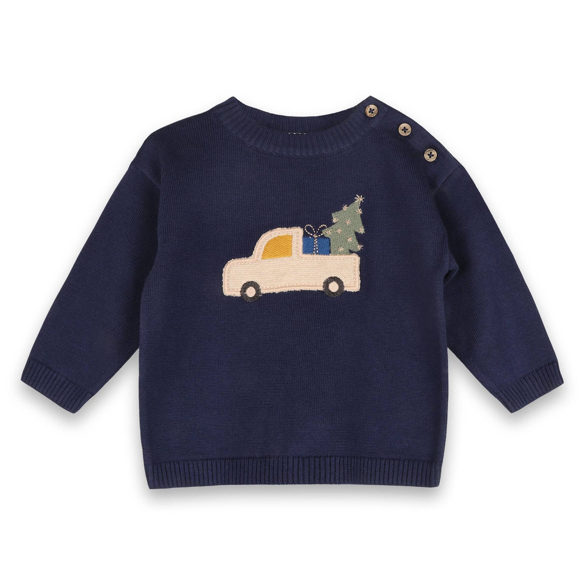 Navy blue sweater with a festive design of a car carrying a tree and presents on a white background