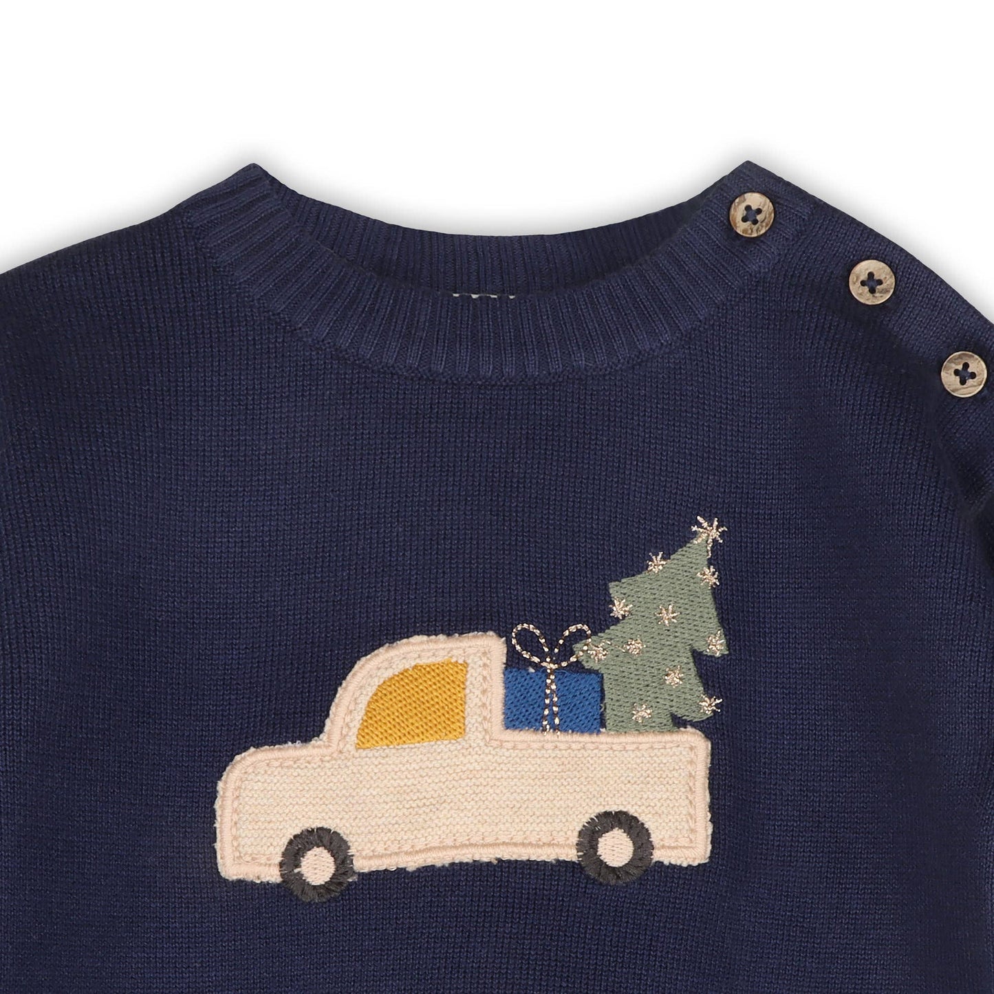 Navy sweater with a Christmas truck and tree design on a white background
