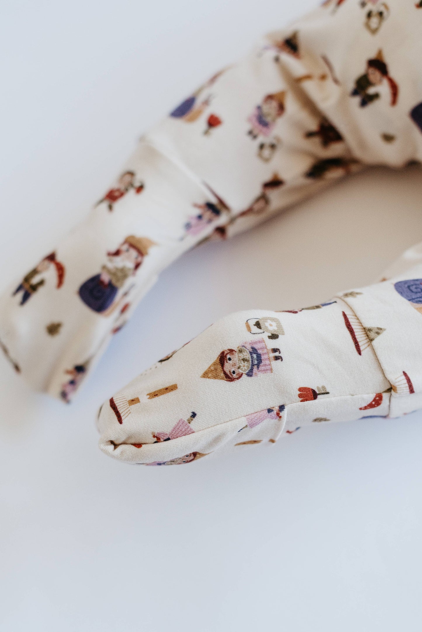 Close-up of a patterned headband on a light background