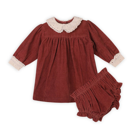 Red velvet dress with lace collar and matching bloomers on a white background