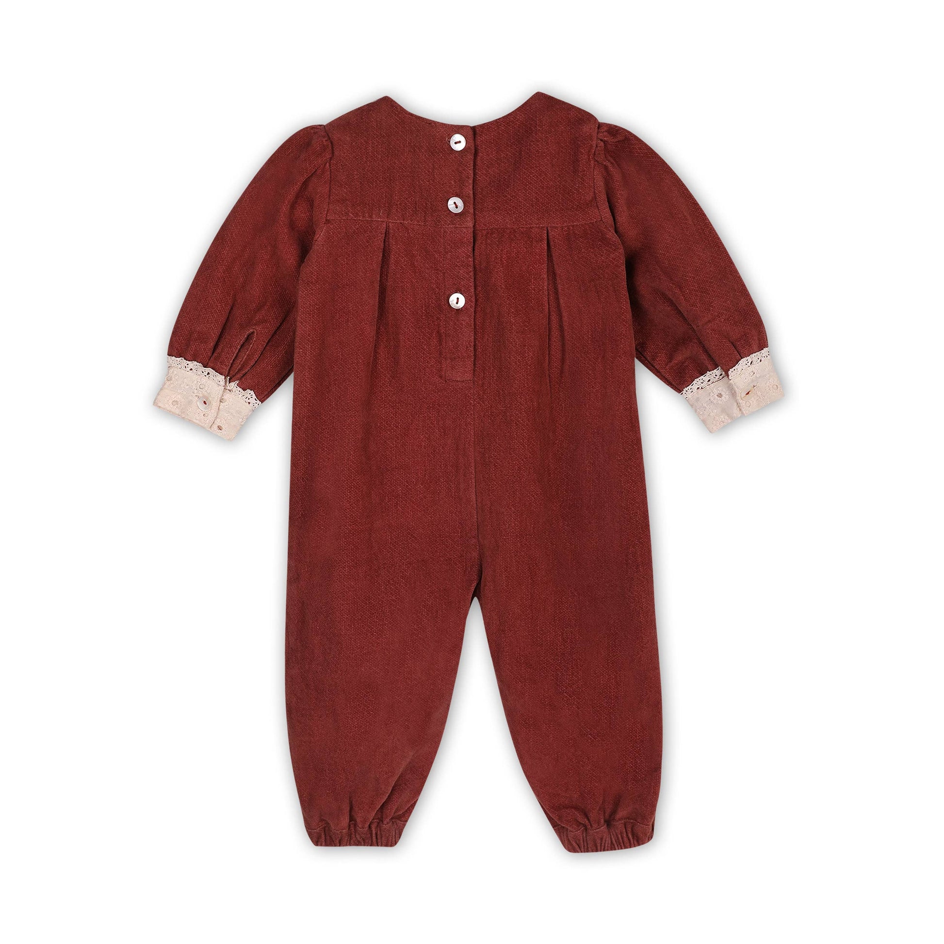 Red corduroy baby jumpsuit with lace trim on a white background