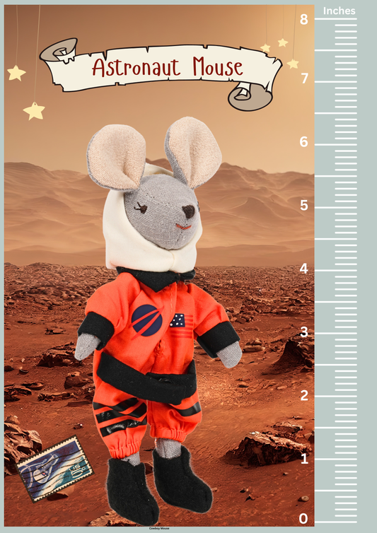 Plush toy mouse in an astronaut suit on a Martian landscape with a ruler for scale.