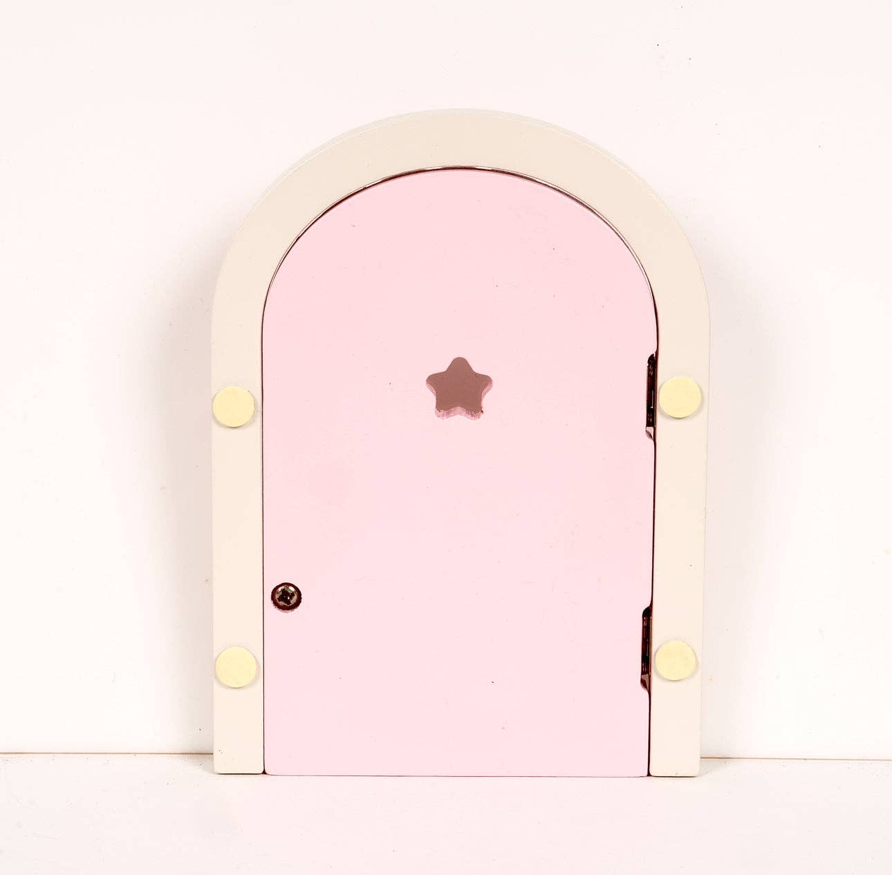 Pink fairy door with a star-shaped handle on a white background