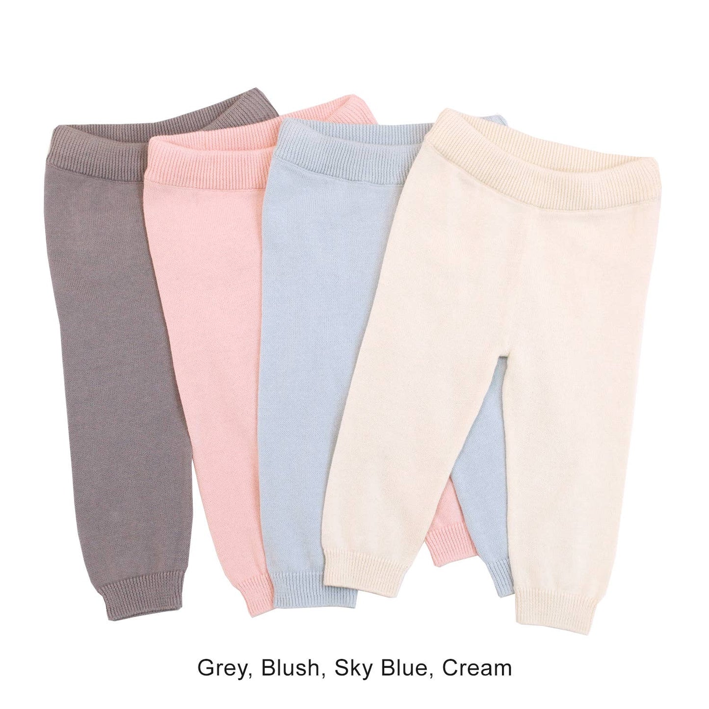 Four pairs of baby leggings in different colors on a white background